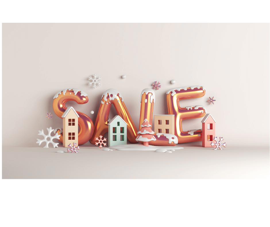 Image: "SALE" with snowflakes and snow covered buildings