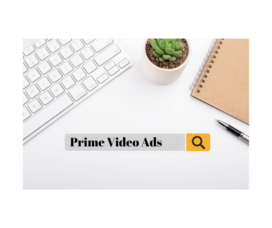 Prime Video Ads search bar on a white desk with a keyboard, notebook, pen, and succulent plant.