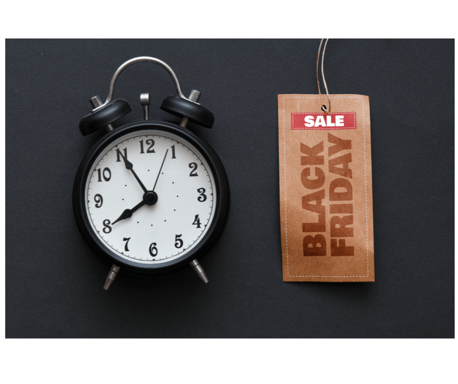 Black Friday sale tag next to a clock, representing urgency for holiday sales preparation